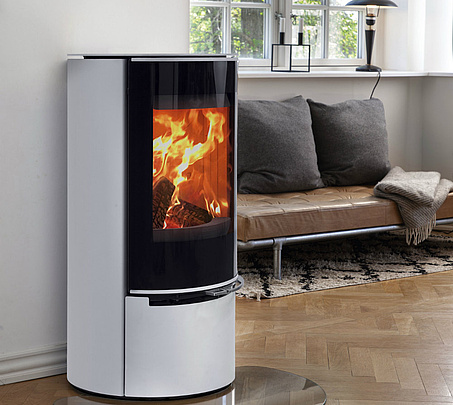White wood burning stove in scandinavian design